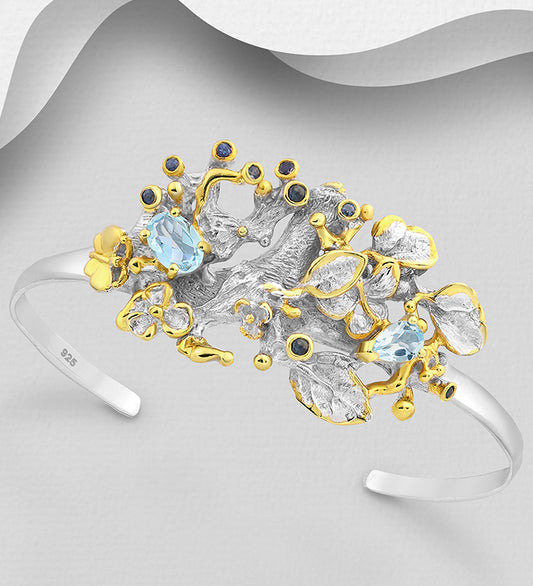 ADIORE - 925 Sterling Silver Leaf Cuff Bracelet, Decorated with Blue Sapphires and Sky-Blue Topaz, Plated with 3 Micron 22K Yellow Gold
