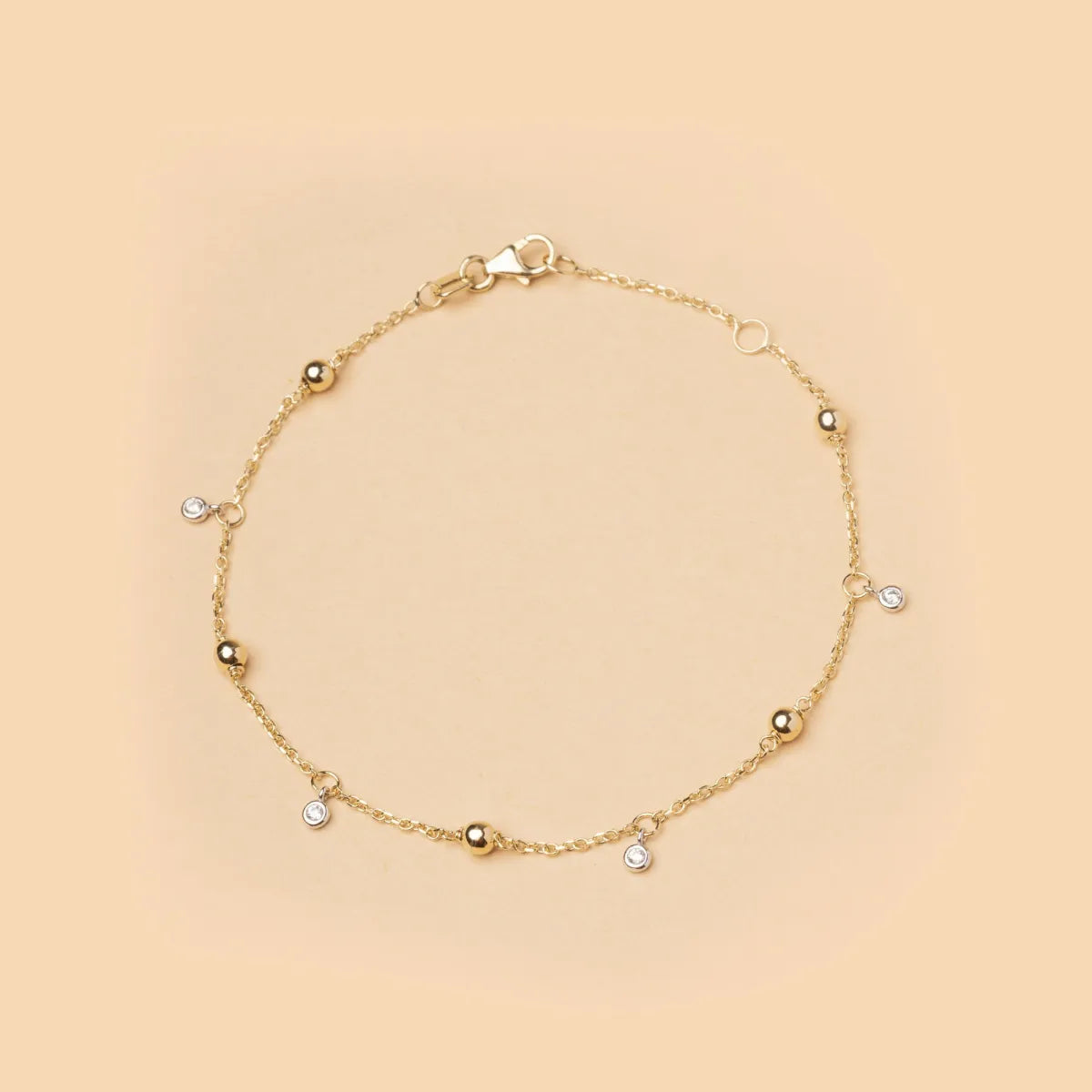 14ct Yellow gold bracelet with spheres and zirconia