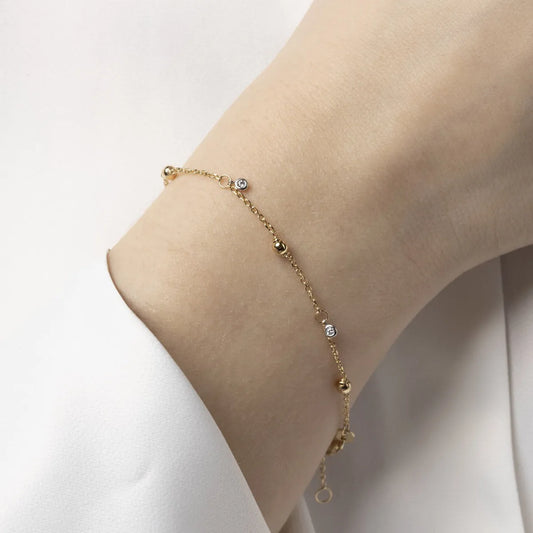 14ct Yellow gold bracelet with spheres and zirconia